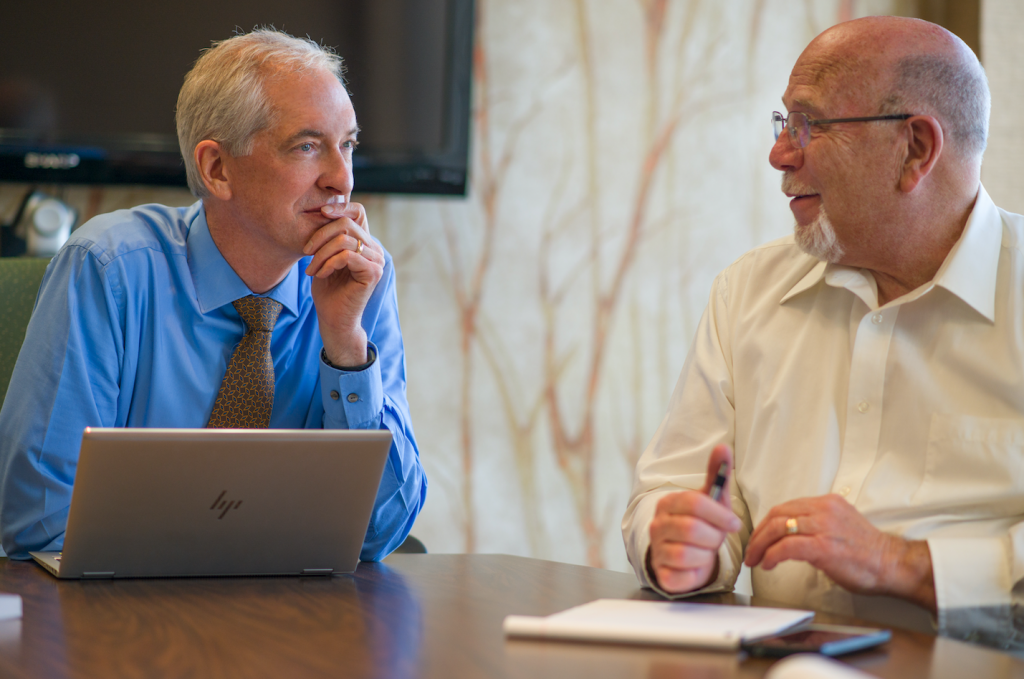 meitler-our-expertise-4 Alan Meitler and Thomas Heding sitting at a conference table